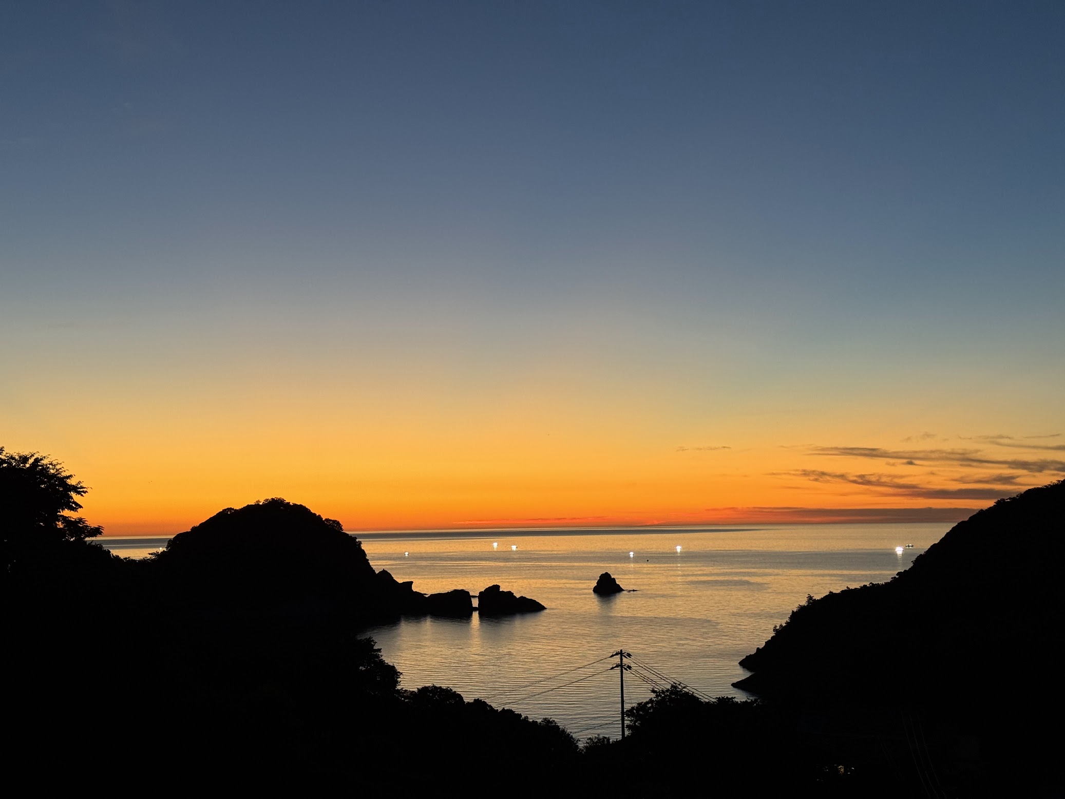 香住海上花火大会があった日のオレンジ色に染まる夕暮れ空